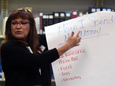 a lady holding a paper